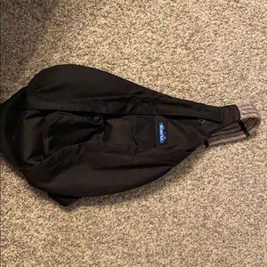 Kavu black sling backpack.